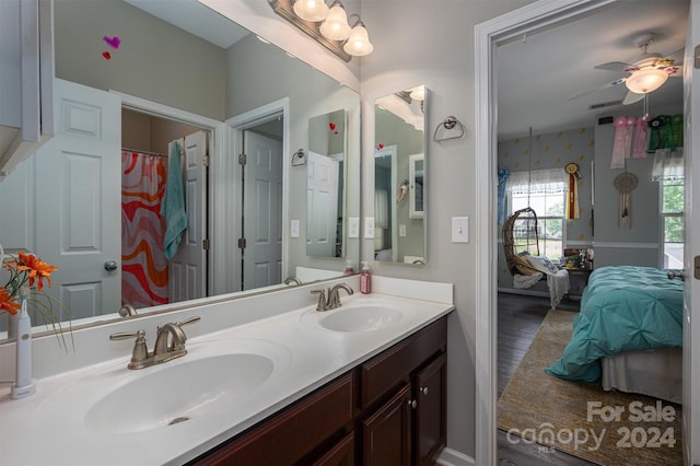 bathroom with ceiling fan and vanity