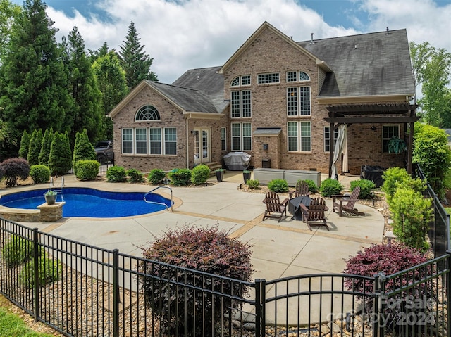 view of pool with a pergola and a patio