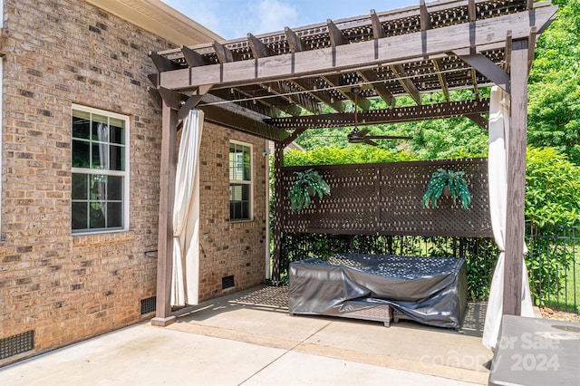 view of patio with a pergola and area for grilling