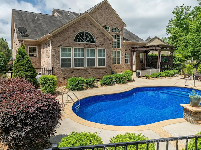 view of pool featuring a pergola and a patio area