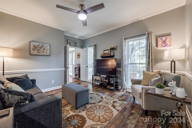 living room featuring ornamental molding, dark hardwood / wood-style flooring, and ceiling fan