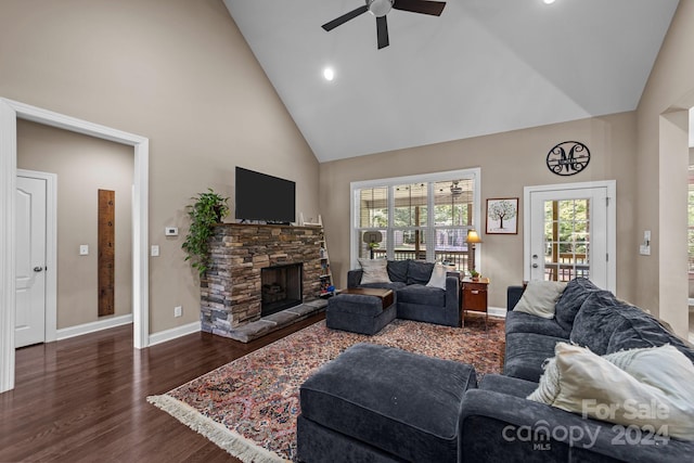 living room with high vaulted ceiling, ceiling fan, a fireplace, and dark hardwood / wood-style flooring