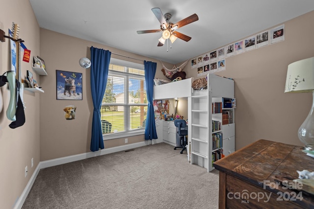 carpeted bedroom with ceiling fan