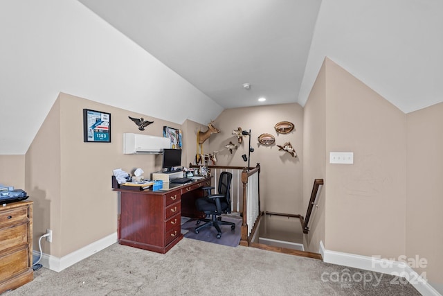 home office with lofted ceiling, a wall unit AC, and light colored carpet