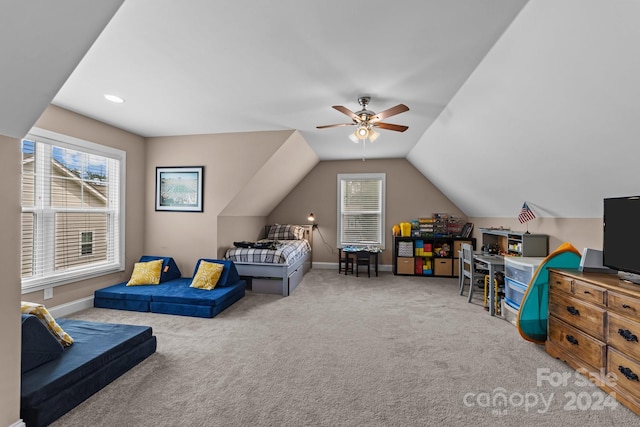 bedroom featuring lofted ceiling, light colored carpet, and ceiling fan