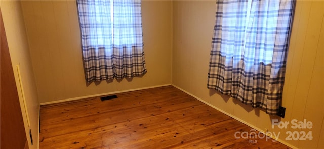 unfurnished room featuring wood-type flooring