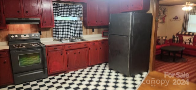 kitchen featuring black appliances and sink