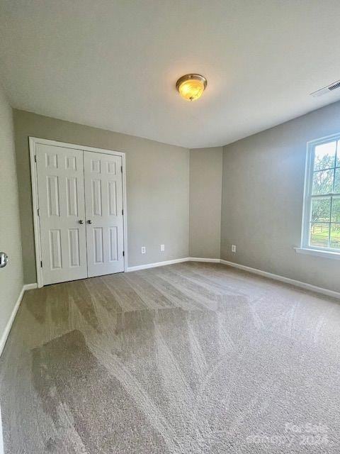 spare room with carpet flooring