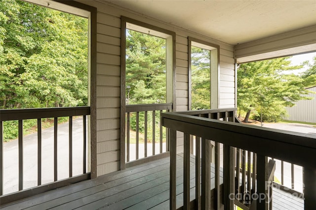 unfurnished sunroom with plenty of natural light