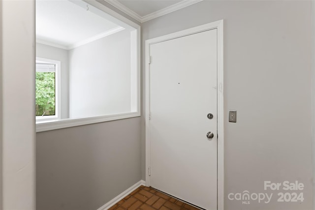 entryway featuring ornamental molding