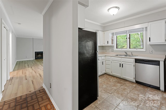 kitchen featuring crown molding, black refrigerator, sink, stainless steel dishwasher, and light hardwood / wood-style floors