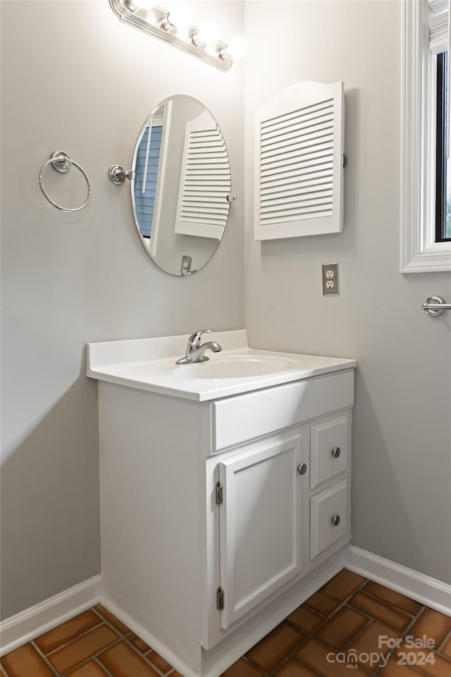 bathroom featuring tile patterned floors and vanity