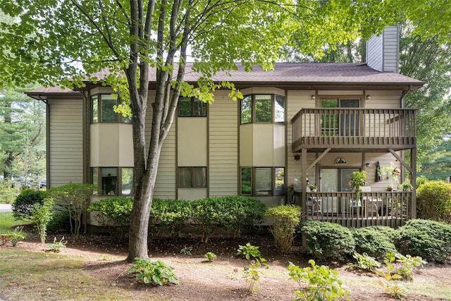 rear view of house with a balcony