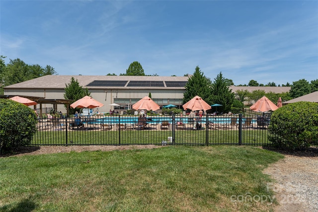 view of yard featuring a community pool