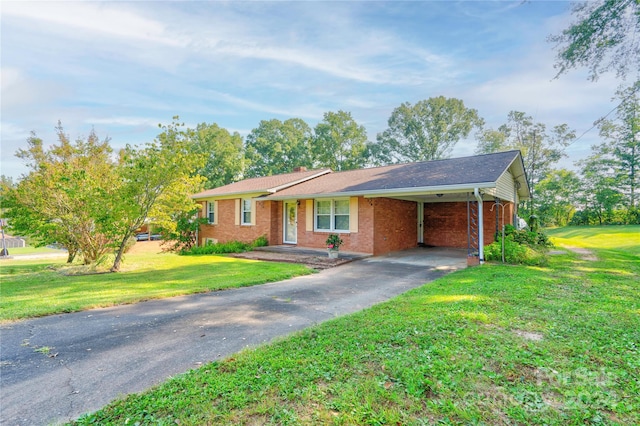 ranch-style house featuring a carport and a front lawn