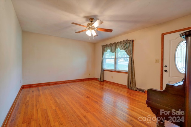 entryway with light wood-type flooring and ceiling fan