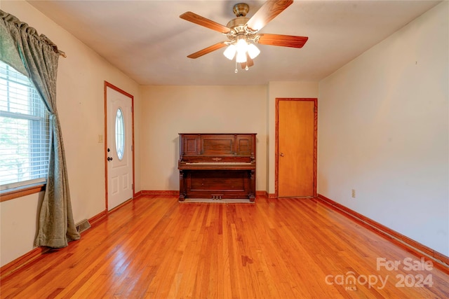 unfurnished bedroom with light wood-type flooring and ceiling fan