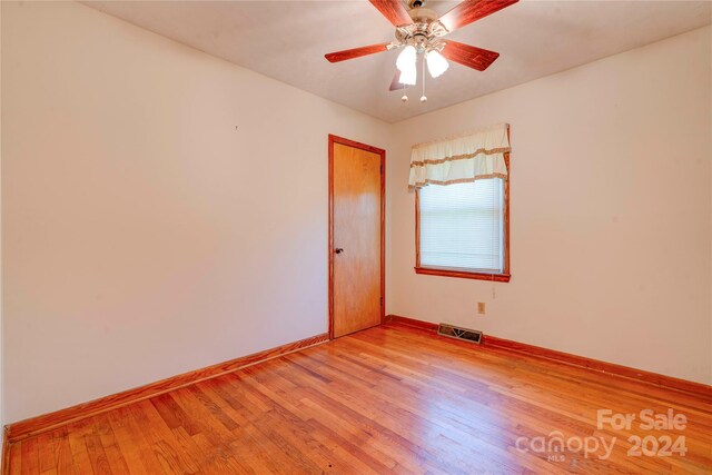 unfurnished room with ceiling fan and light hardwood / wood-style floors