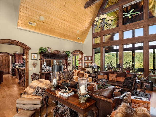 85 Smokey Ridge Trl, Arden, NC 28704 - living area with high vaulted ceiling, wood finished floors, arched walkways, and wooden ceiling with exposed beams