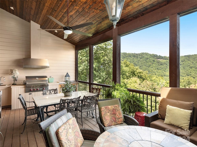 85 Smokey Ridge Trl, Arden, NC 28704 - wooden terrace featuring outdoor dining area, ceiling fan, and a wooded view