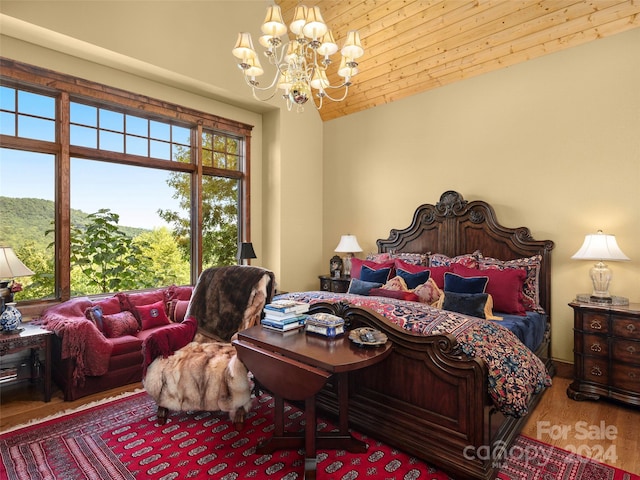 bedroom with wooden ceiling, lofted ceiling, hardwood / wood-style floors, and a chandelier