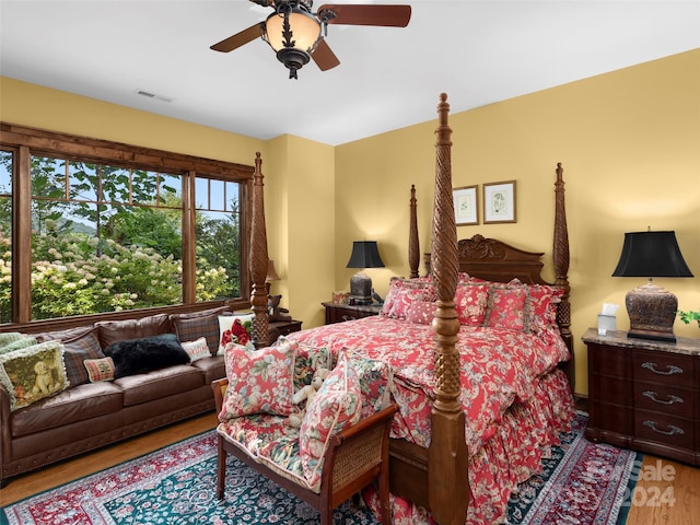 bedroom with ceiling fan and light wood-type flooring