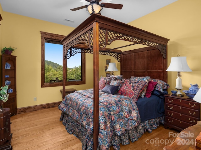 bedroom featuring ceiling fan and light hardwood / wood-style floors