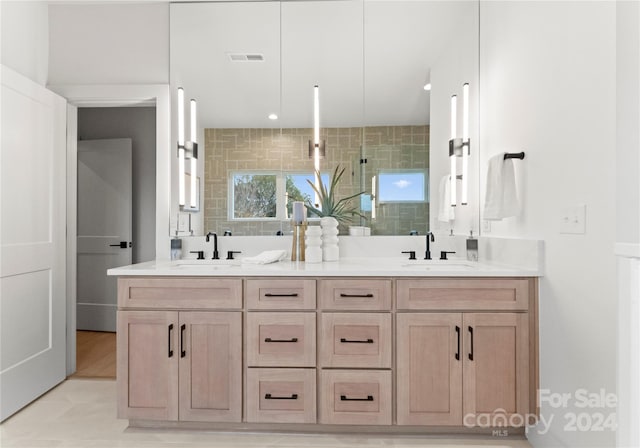 bathroom featuring a shower, vanity, and tile patterned flooring