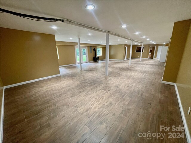 basement with hardwood / wood-style flooring