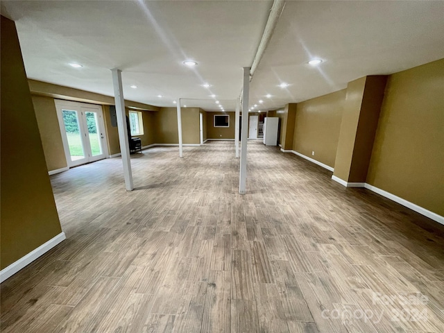 basement featuring light hardwood / wood-style flooring