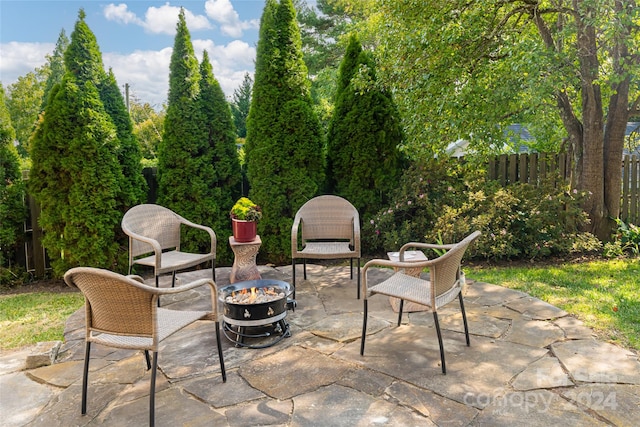 view of patio with a fire pit