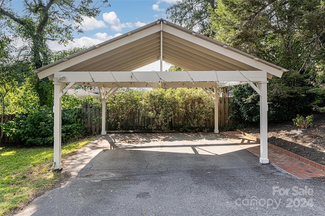 view of parking / parking lot with a carport