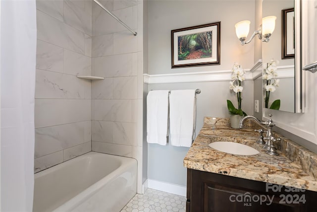 full bath featuring baseboards, shower / tub combination, and vanity