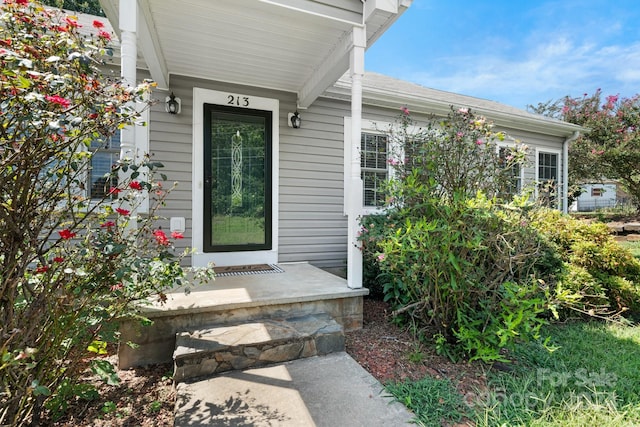 doorway to property featuring a porch