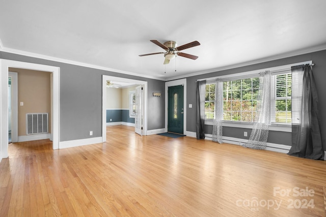 unfurnished living room with light wood-type flooring, crown molding, and ceiling fan