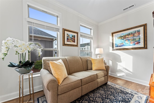 living room featuring ornamental molding and hardwood / wood-style floors