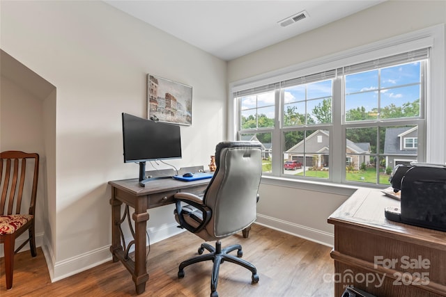 office area with hardwood / wood-style floors