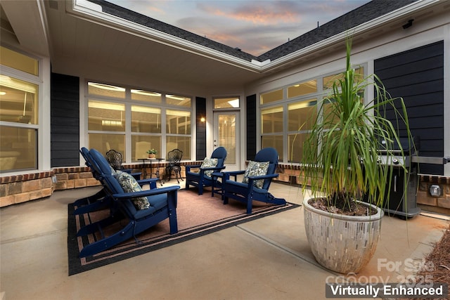 view of patio terrace at dusk