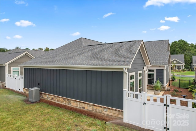 view of side of property with a yard