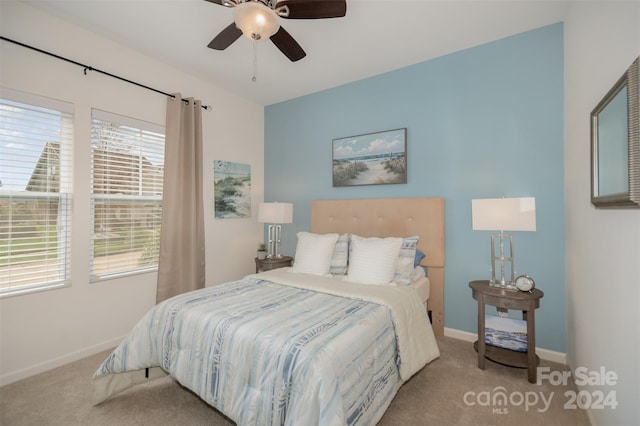 bedroom with light colored carpet and ceiling fan