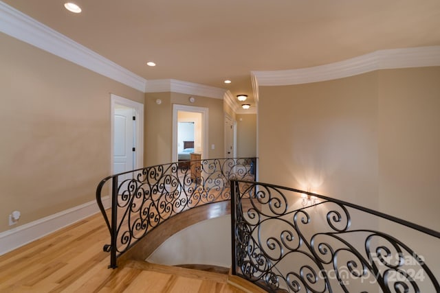 interior space with light hardwood / wood-style floors and crown molding