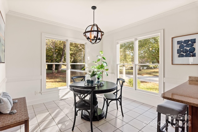 tiled dining space featuring ornamental molding, a chandelier, and plenty of natural light