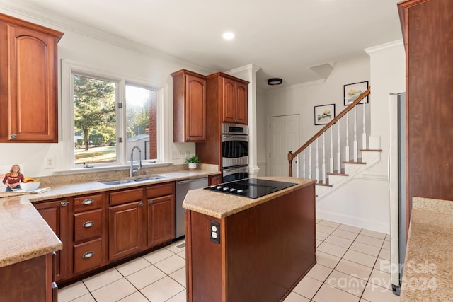 kitchen featuring sink, light stone countertops, crown molding, light tile patterned flooring, and appliances with stainless steel finishes