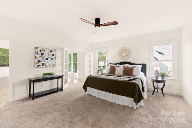 bedroom with light carpet and ceiling fan