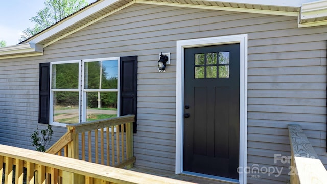 doorway to property with a wooden deck