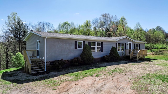 view of front of property with a wooden deck