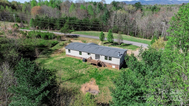 birds eye view of property featuring a mountain view