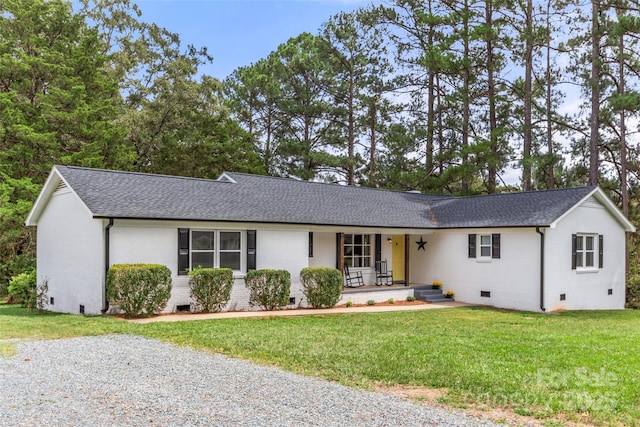 ranch-style home featuring a porch and a front yard