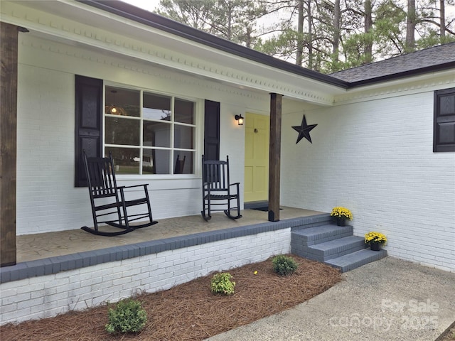 doorway to property with a porch