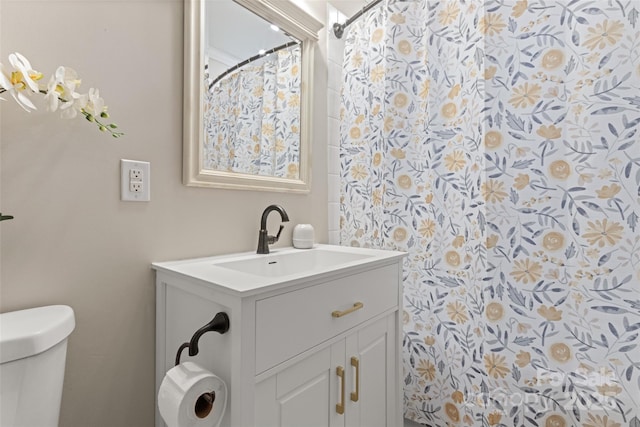 bathroom with vanity and toilet